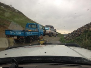 Towing small truck over slippery hill 3     